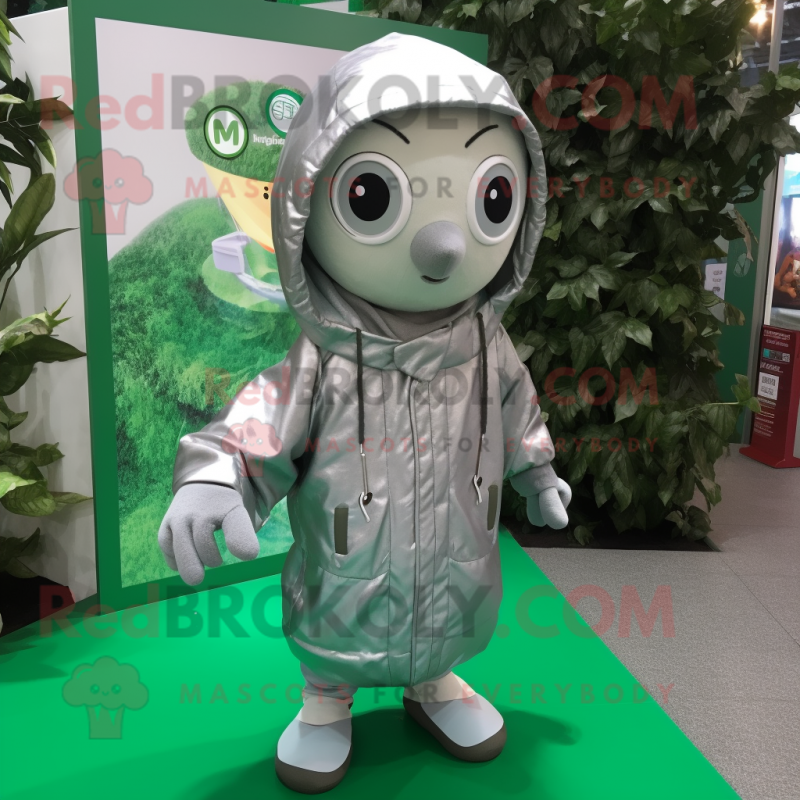 Silver Spinach mascot costume character dressed with a Parka and Keychains Silver Spinach mascot costume character dressed with a Parka and Keychains
