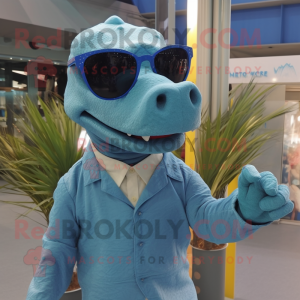 Blue Iguanodon mascot costume character dressed with a Cardigan and Sunglasses