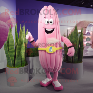 Pink Asparagus mascot costume character dressed with a Rash Guard and Rings