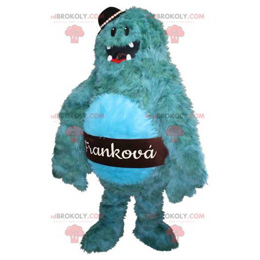 Haariges und lustiges blaues Monstermaskottchen.