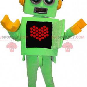 Grön och gul robotmaskot med ett hjärta på magen -