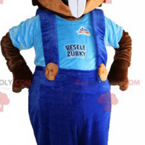 Brown squirrel mascot with big teeth and overalls -