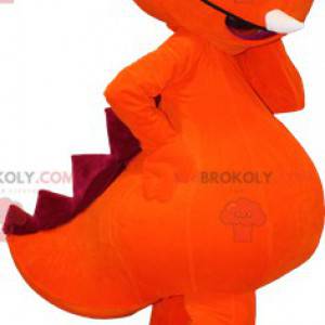 Gigantyczna pomarańczowa i czerwona maskotka dinozaura -