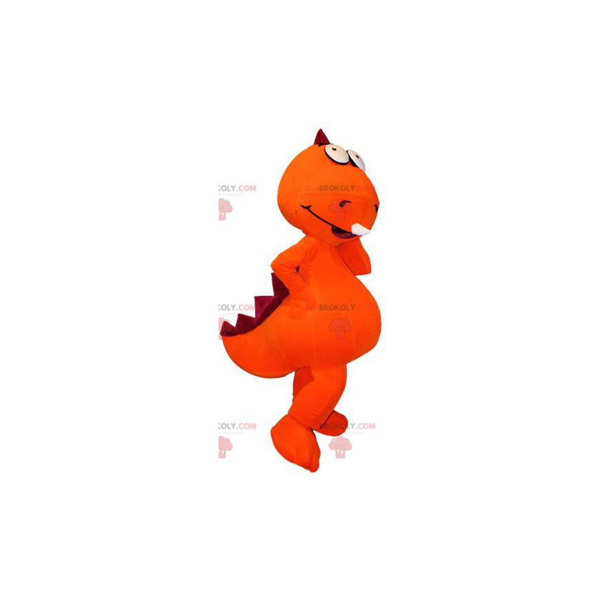 Mascote gigante de dinossauro laranja e vermelho -