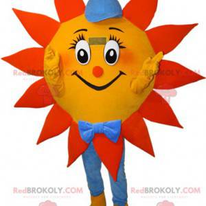 Orange gelbes und blaues Sonnenmaskottchen mit einer Kappe -
