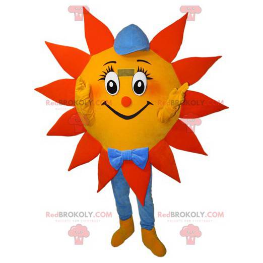 Mascota de sol naranja amarillo y azul con gorra -