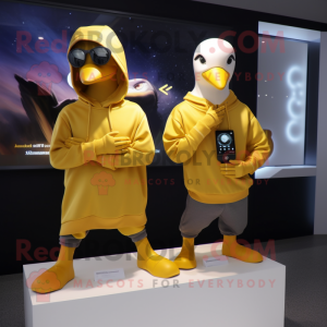 Gold Gull mascot costume character dressed with a Hoodie and Smartwatches