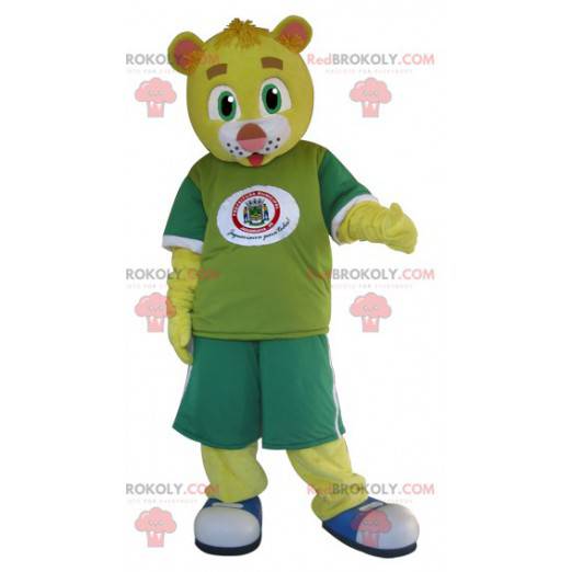 Gelbes Teddybärmaskottchen gekleidet in Grün - Redbrokoly.com