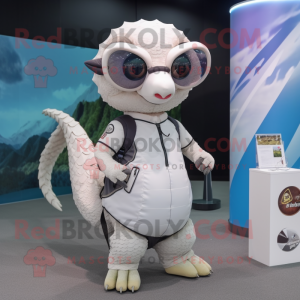 White Pangolin mascot costume character dressed with a T-Shirt and Eyeglasses