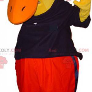 Gigantyczna żółta kaczka maskotka ubrana w czarno-czerwony -