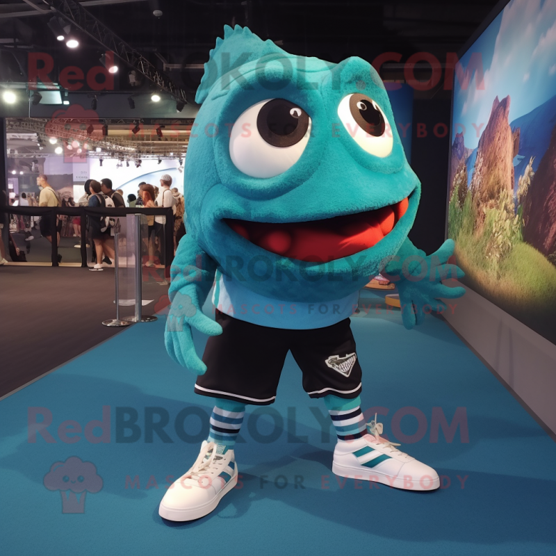 Teal Piranha mascot costume character dressed with a Long Sleeve Tee and Shoe laces