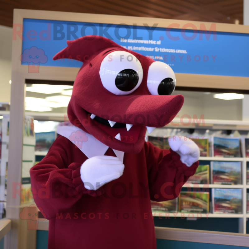 Maroon Dolphin mascot costume character dressed with a Sweater and Reading glasses