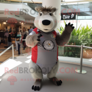 Gray Capybara mascot costume character dressed with a T-Shirt and Bracelet watches