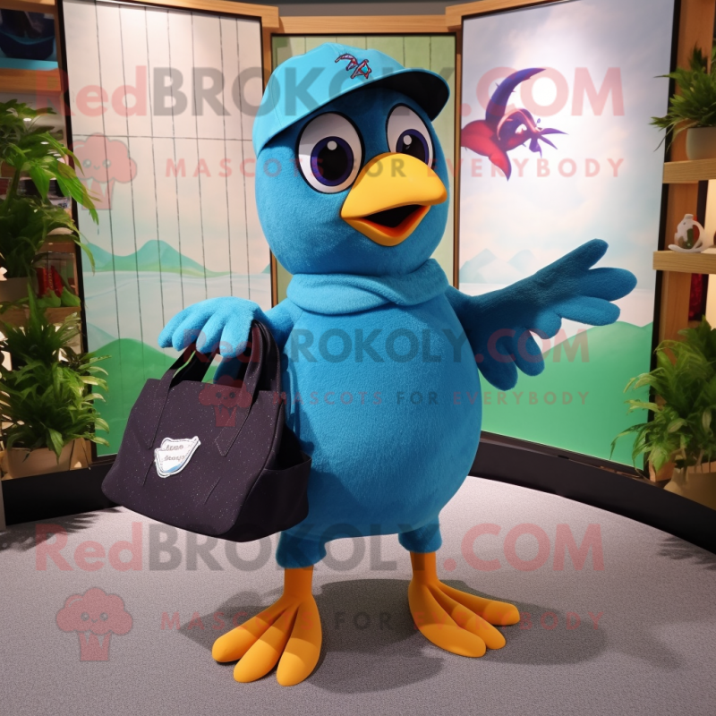 Cyan Blackbird mascot costume character dressed with a Bermuda Shorts and Tote bags Cyan Blackbird mascot costume character dressed with a Bermuda Shorts and Tote bags