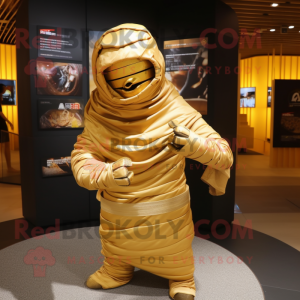 Gold Mummy mascot costume character dressed with a Hoodie and Messenger bags