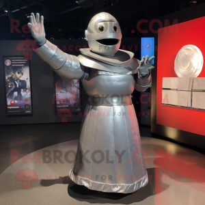 Silver Human Cannon Ball mascot costume character dressed with a Empire Waist Dress and Wraps