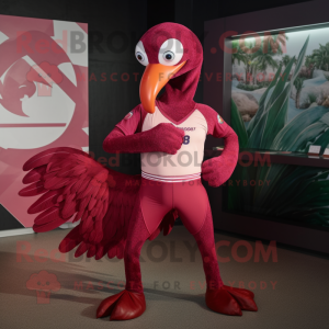 Maroon Flamingo mascot costume character dressed with a Rash Guard and Wraps