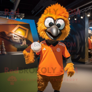 Orange Emu mascot costume character dressed with a Rugby Shirt and Caps