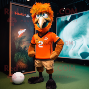 Orange Emu mascot costume character dressed with a Rugby Shirt and Caps