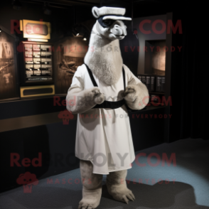 Gray Camel mascot costume character dressed with a Tuxedo and Wraps