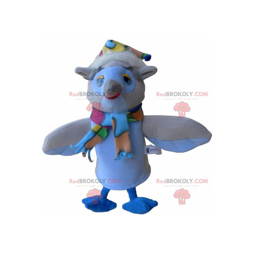 Beige and white owl mascot with a scarf and a hat -