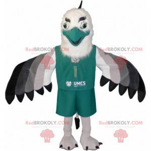 Black and gray white vulture eagle mascot dressed in green -