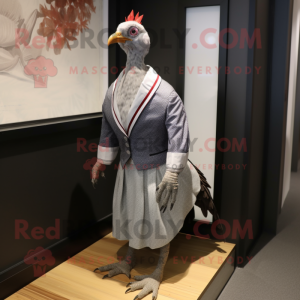 Silver Guinea Fowl mascot costume character dressed with a Shift Dress and Pocket squares