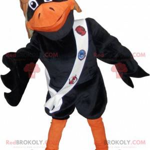 Mascotte de corbeau noir et orange avec un casque de pilote -