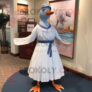 White Passenger Pigeon mascot costume character dressed with a Wrap Skirt and Ties