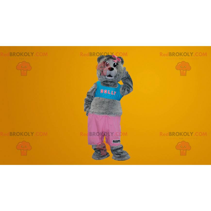 Graues Teddybärmaskottchen gekleidet in Rosa und Blau -