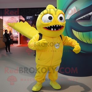 Lemon Yellow Barracuda mascot costume character dressed with a Graphic Tee and Mittens