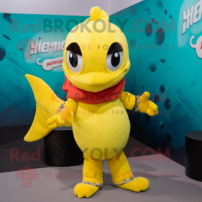 Lemon Yellow Barracuda mascot costume character dressed with a Graphic Tee and Mittens