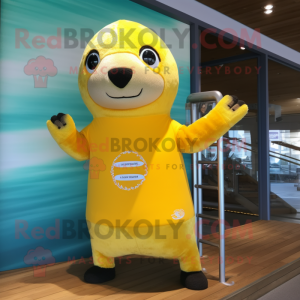 Yellow Seal mascot costume character dressed with a Board Shorts and Mittens