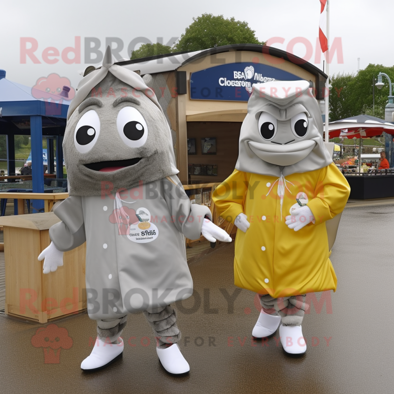 Silver Fish And Chips mascot costume character dressed with a Raincoat and Cummerbunds