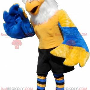 Mascotte d'aigle jaune bleu et blanc avec un short noir -