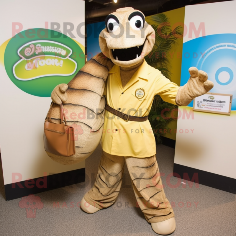 Gold Titanoboa mascot costume character dressed with a Button-Up Shirt and Clutch bags