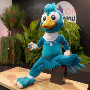 Turquoise Eagle mascot costume character dressed with a Yoga Pants and Anklets