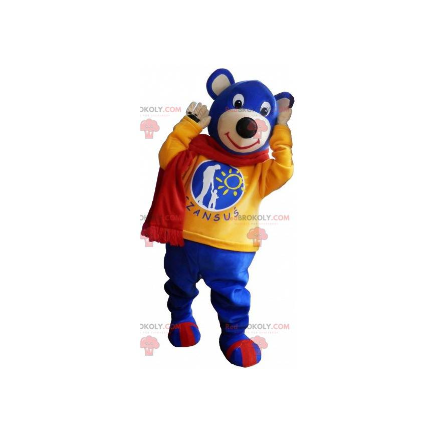 Mascotte blauwe teddy met een gele trui en een sjaal -