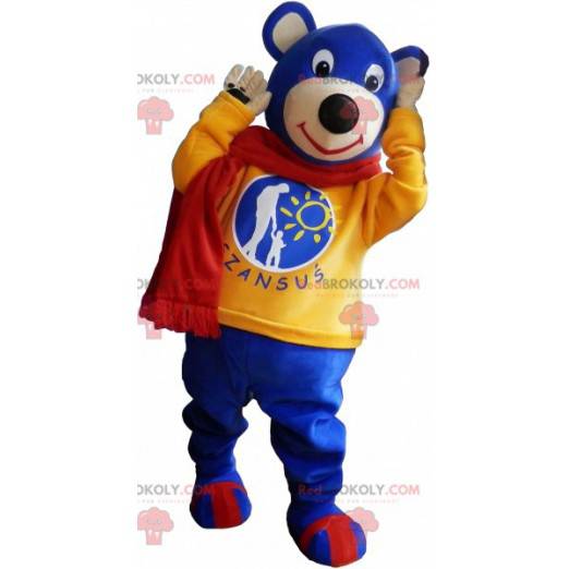 Blaues Teddy-Maskottchen mit gelbem Pullover und Schal -