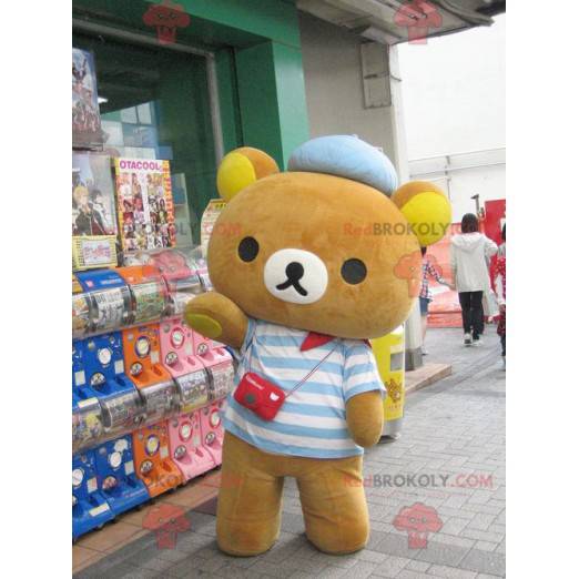 Mascot lille brun bjørn klædt i en stribet sweater -