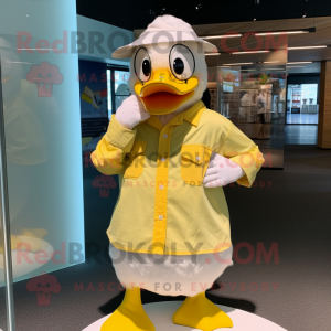 Lemon Yellow Muscovy Duck mascot costume character dressed with a Poplin Shirt and Rings