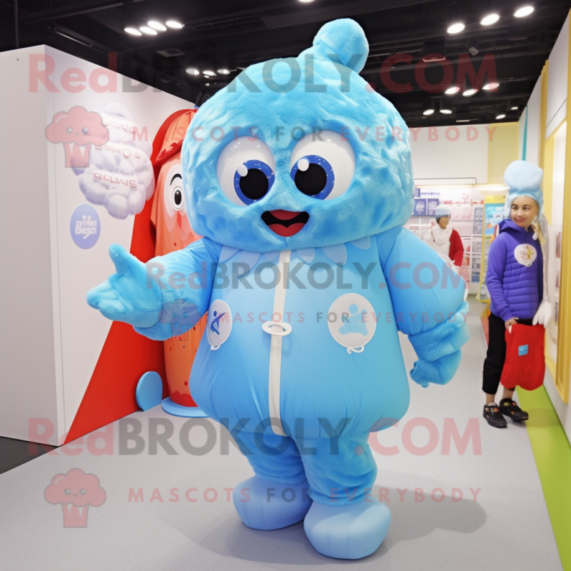 Sky Blue Candy mascot costume character dressed with a Windbreaker and Mittens