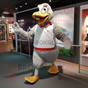 Gray Geese mascot costume character dressed with a Running Shorts and Gloves