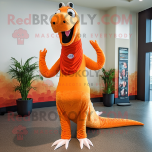 Orange Diplodocus mascot costume character dressed with a Yoga Pants and Shawl pins