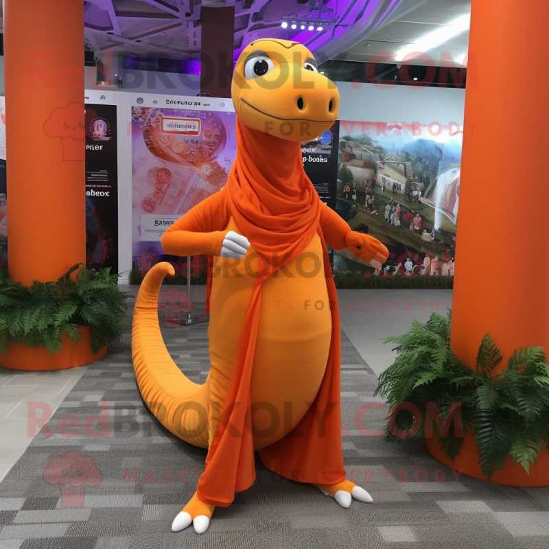 Orange Diplodocus mascot costume character dressed with a Yoga Pants and Shawl pins Orange Diplodocus mascot costume character dressed with a Yoga Pants and Shawl pins