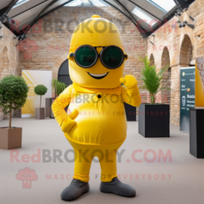 Yellow Irish Castle mascot costume character dressed with a Jumpsuit and Sunglasses