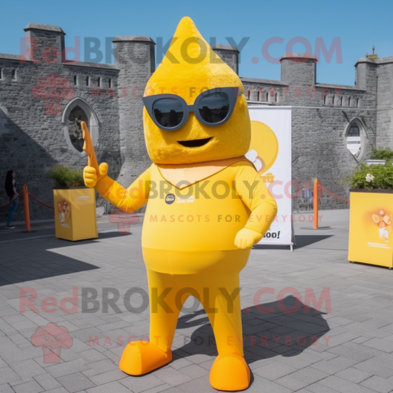 Yellow Irish Castle mascot costume character dressed with a Jumpsuit and Sunglasses Yellow Irish Castle mascot costume character dressed with a Jumpsuit and Sunglasses