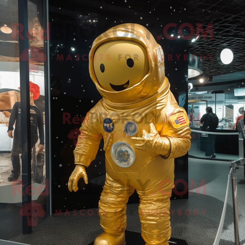 Gold Astronaut mascot costume character dressed with a Cover-up and Hair clips Gold Astronaut mascot costume character dressed with a Cover-up and Hair clips