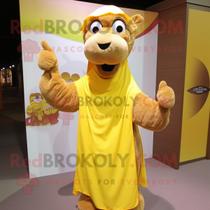 Yellow Camel mascot costume character dressed with a Long Sleeve Tee and Shawl pins