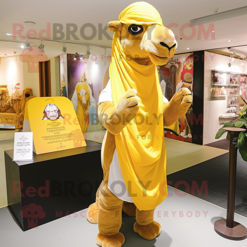 Yellow Camel mascot costume character dressed with a Long Sleeve Tee and Shawl pins